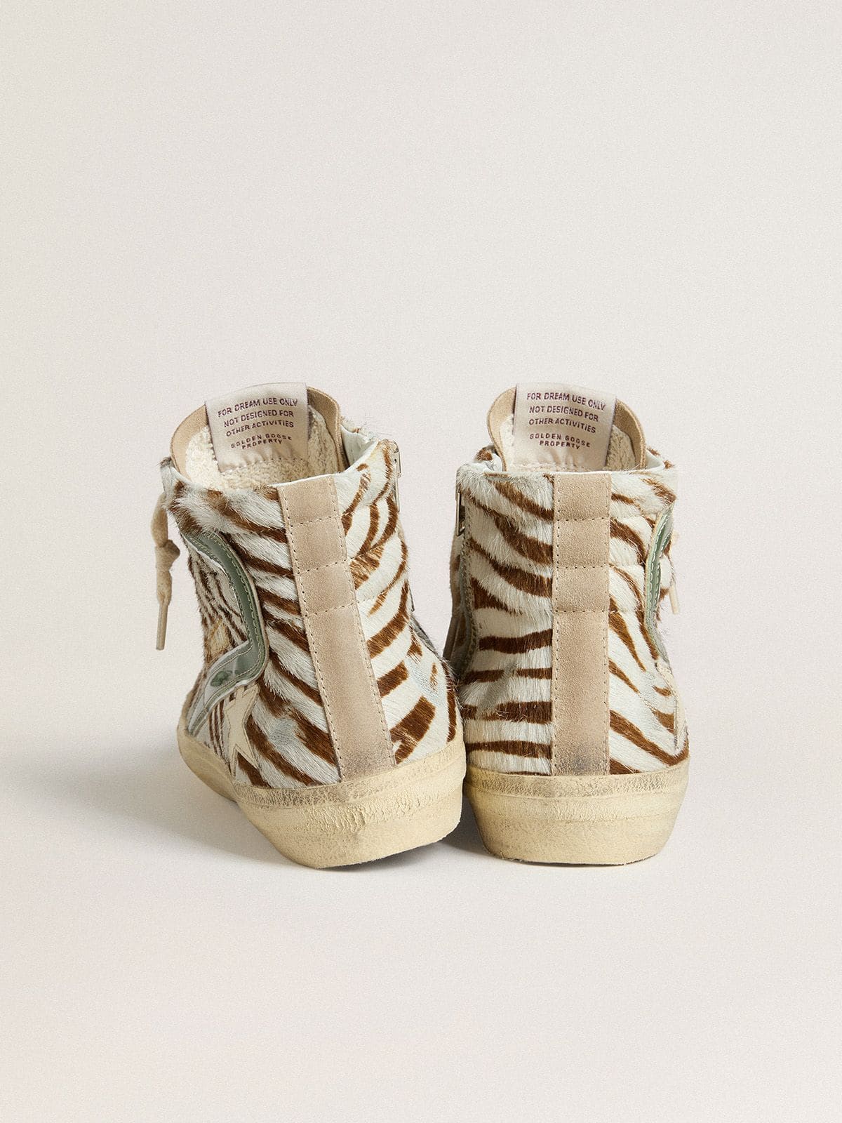 Women's Slide in zebra-print pony skin with green laminated leather flash | Golden Goose