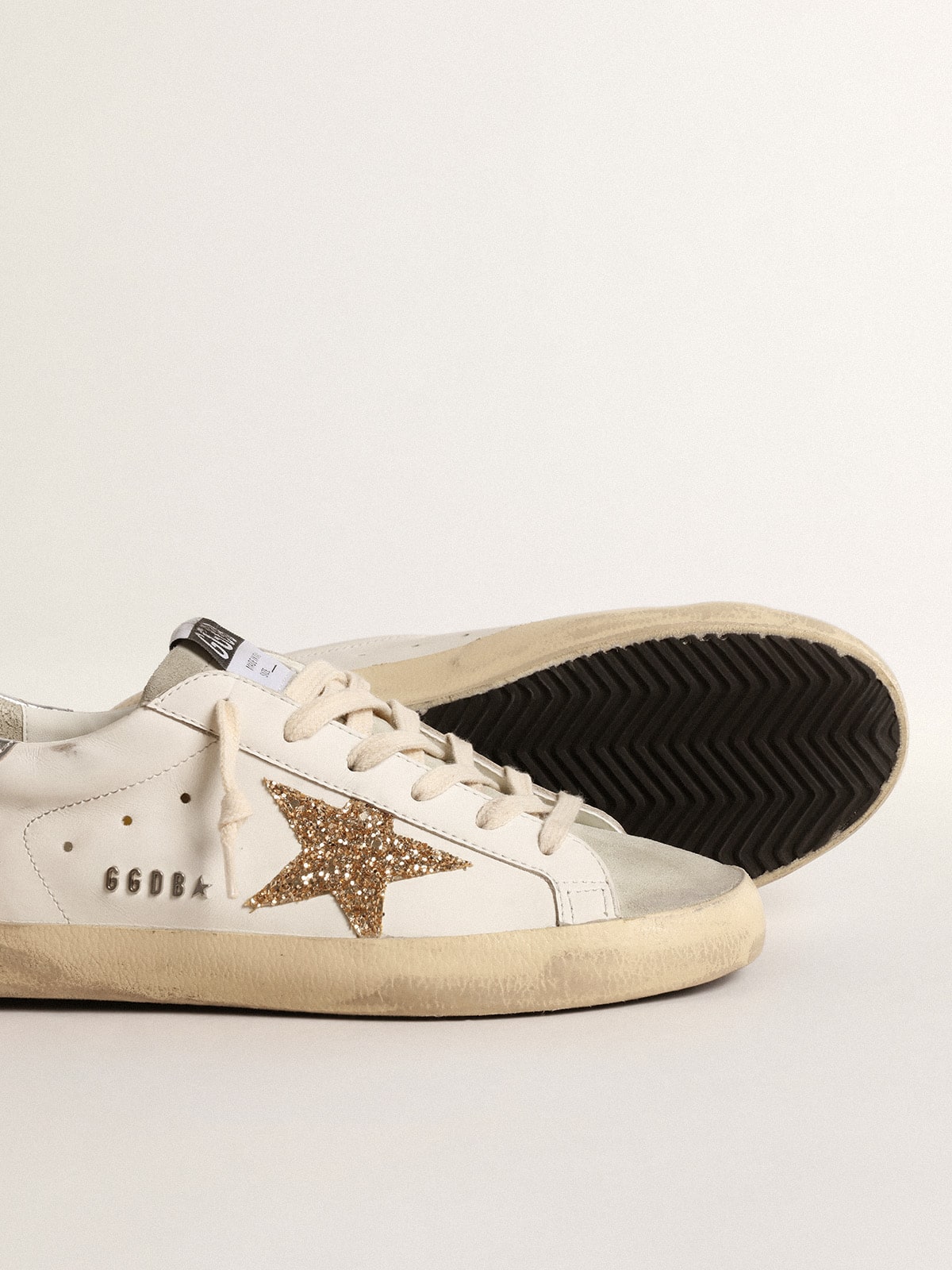 Women's Super-Star with gold glitter star and ice-gray suede inserts | Golden Goose