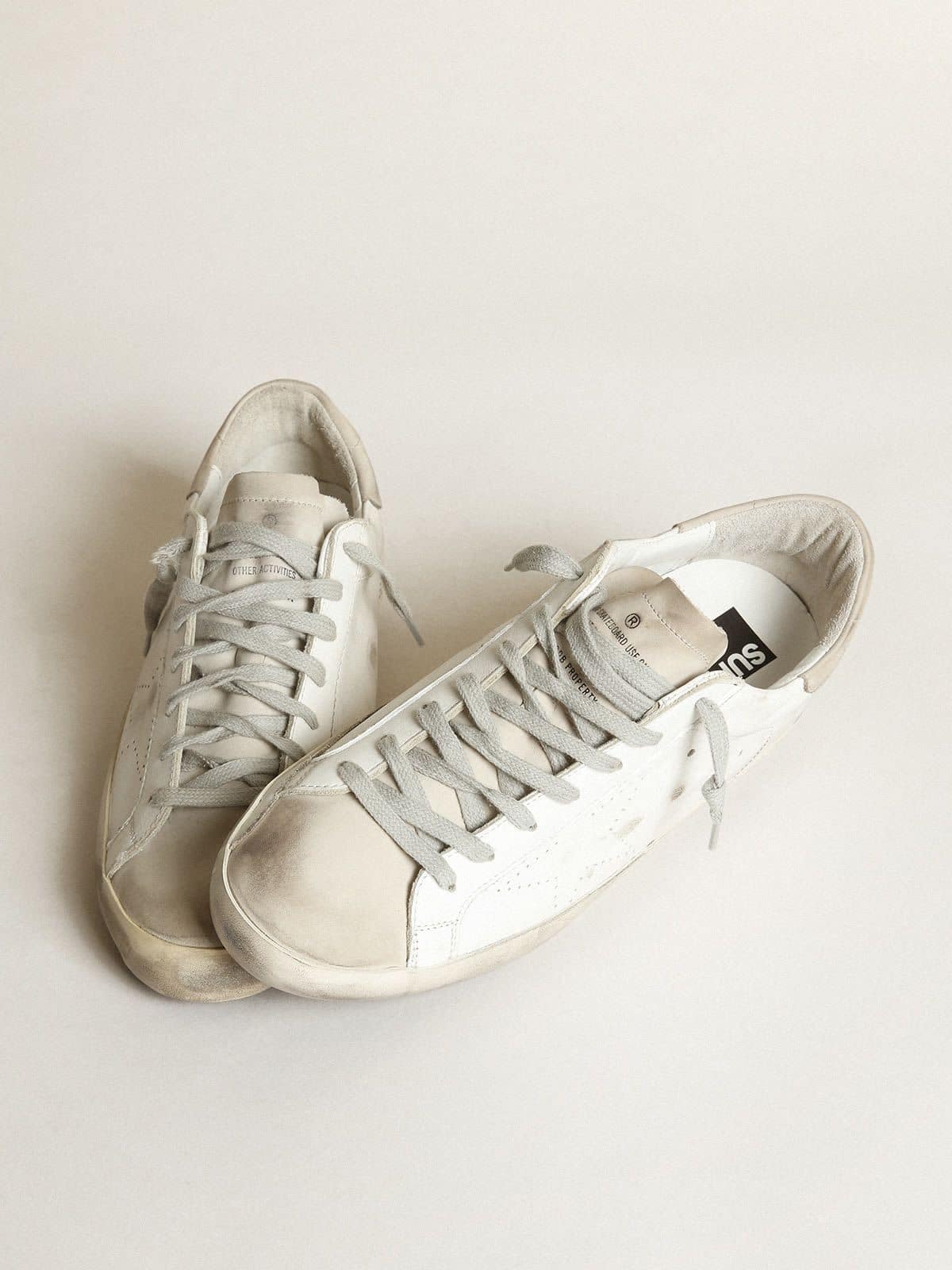 Women's Super-Star in white leather with perforated star and beige nubuck heel tab | Golden Goose