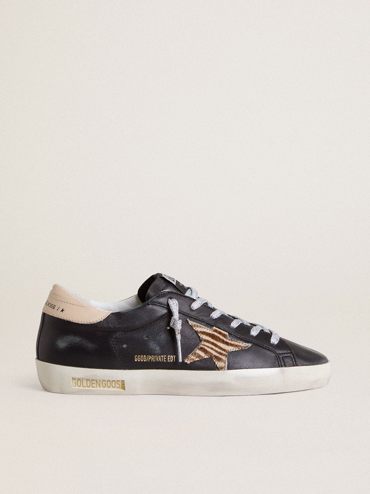 Women’s Super-Star in black nappa leather with zebra-print pony skin star and beige leather heel tab | Golden Goose
