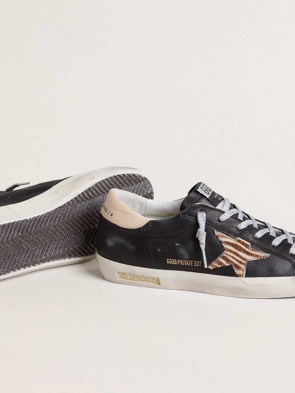 Women’s Super-Star in black nappa leather with zebra-print pony skin star and beige leather heel tab | Golden Goose