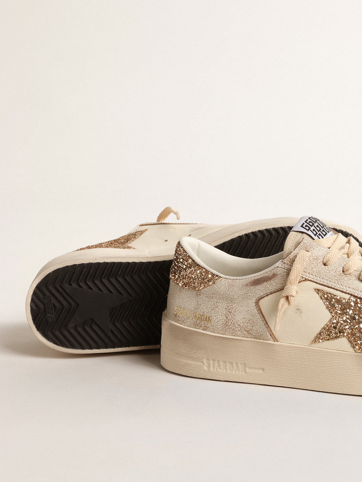 Women’s Stardan in ecru nappa leather with gold glitter star and heel tab | Golden Goose