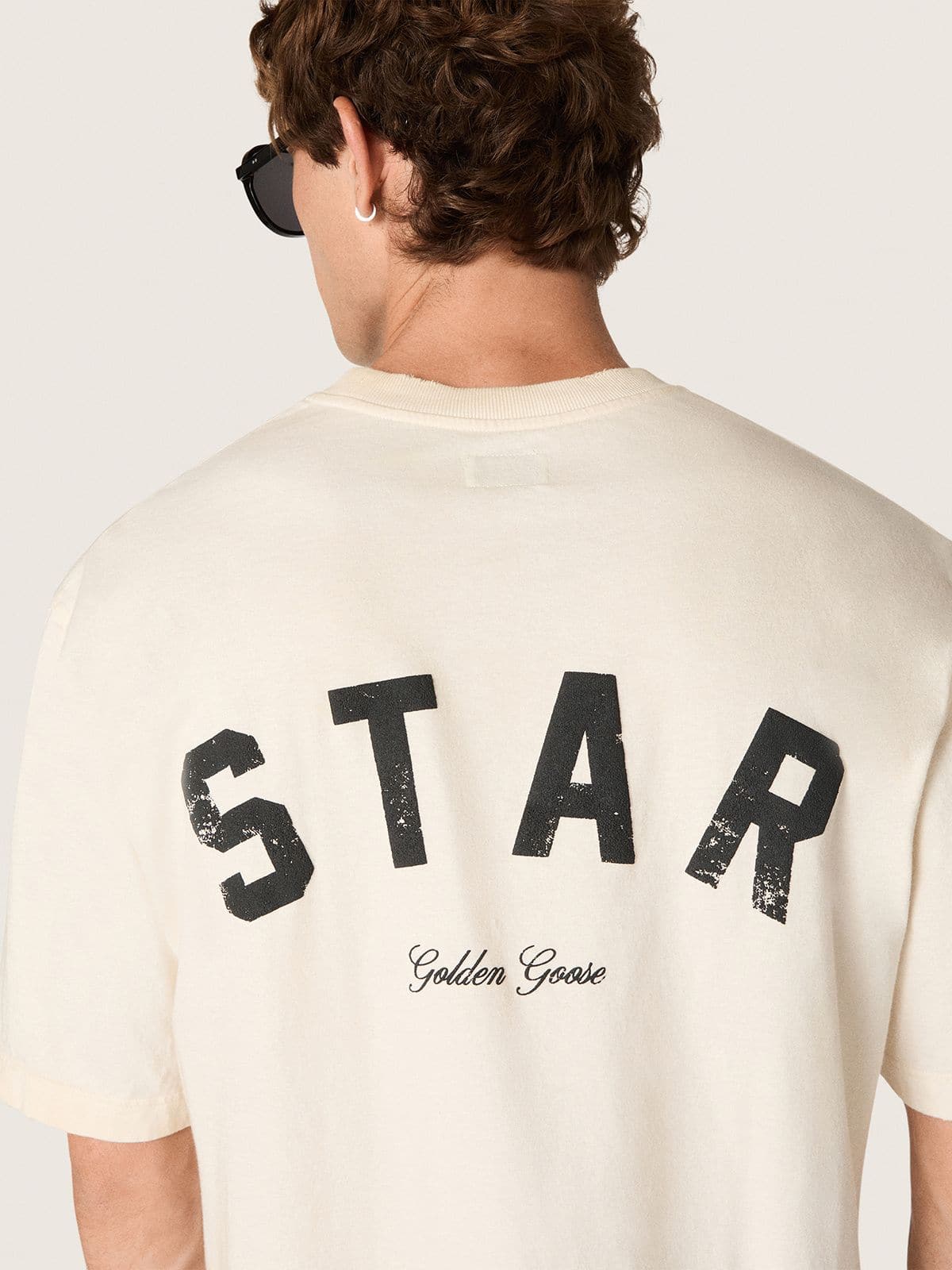 Star unisex cotton T-shirt in vintage white with black print on the back | Golden Goose
