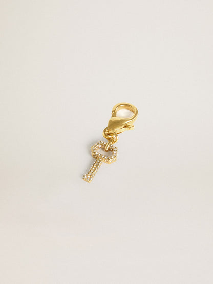 Key-shaped charm in gold-colored brass with crystals | Golden Goose