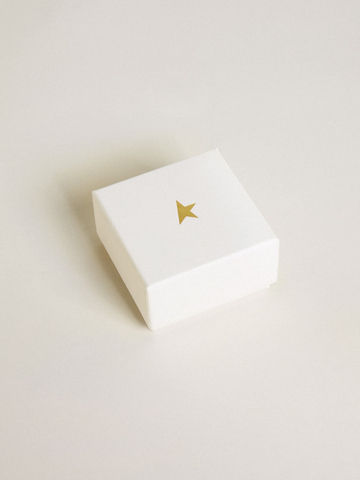 Key-shaped charm in gold-colored brass with crystals | Golden Goose