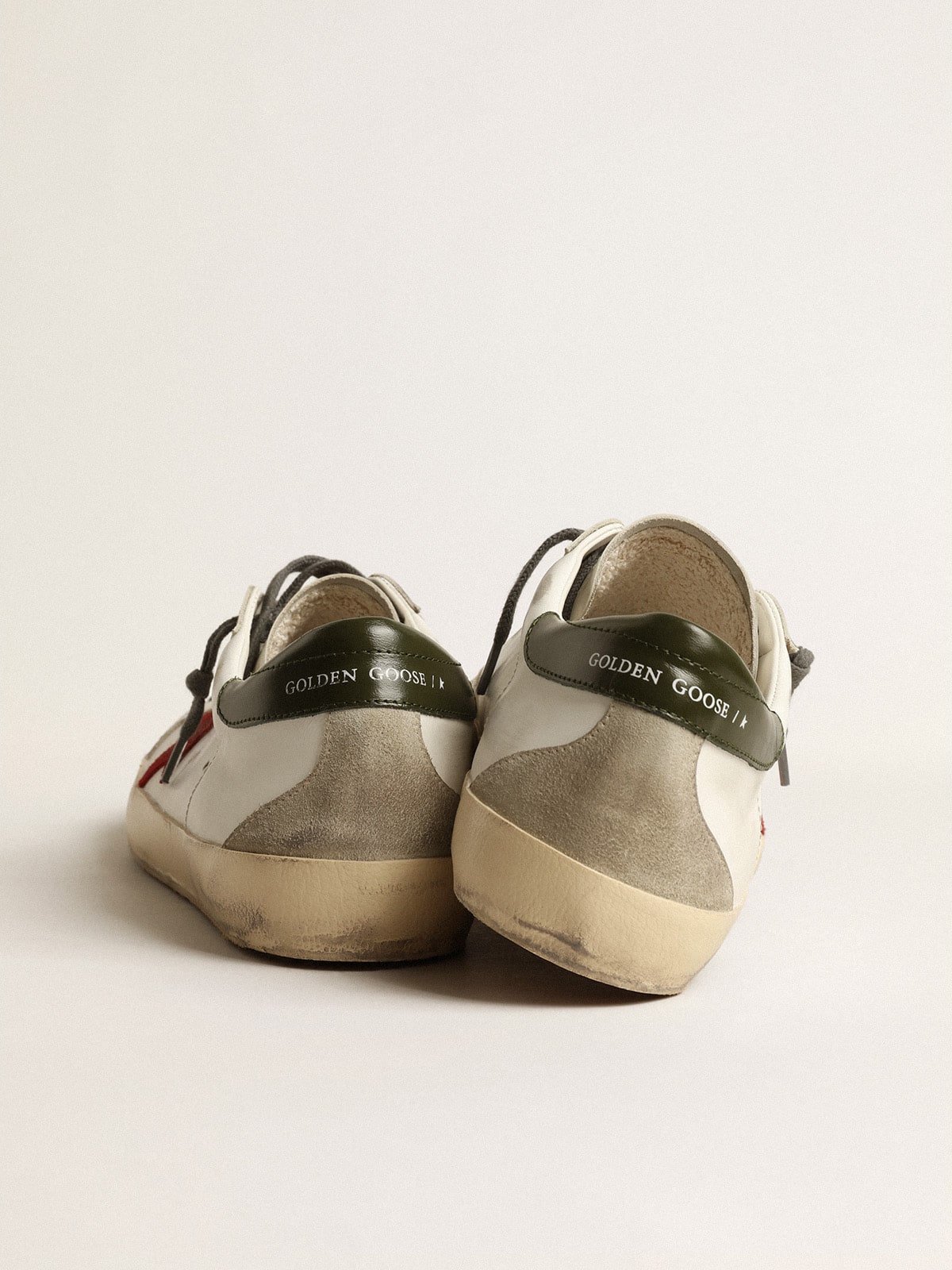 Men's Super-Star with red suede star and green leather heel tab | Golden Goose
