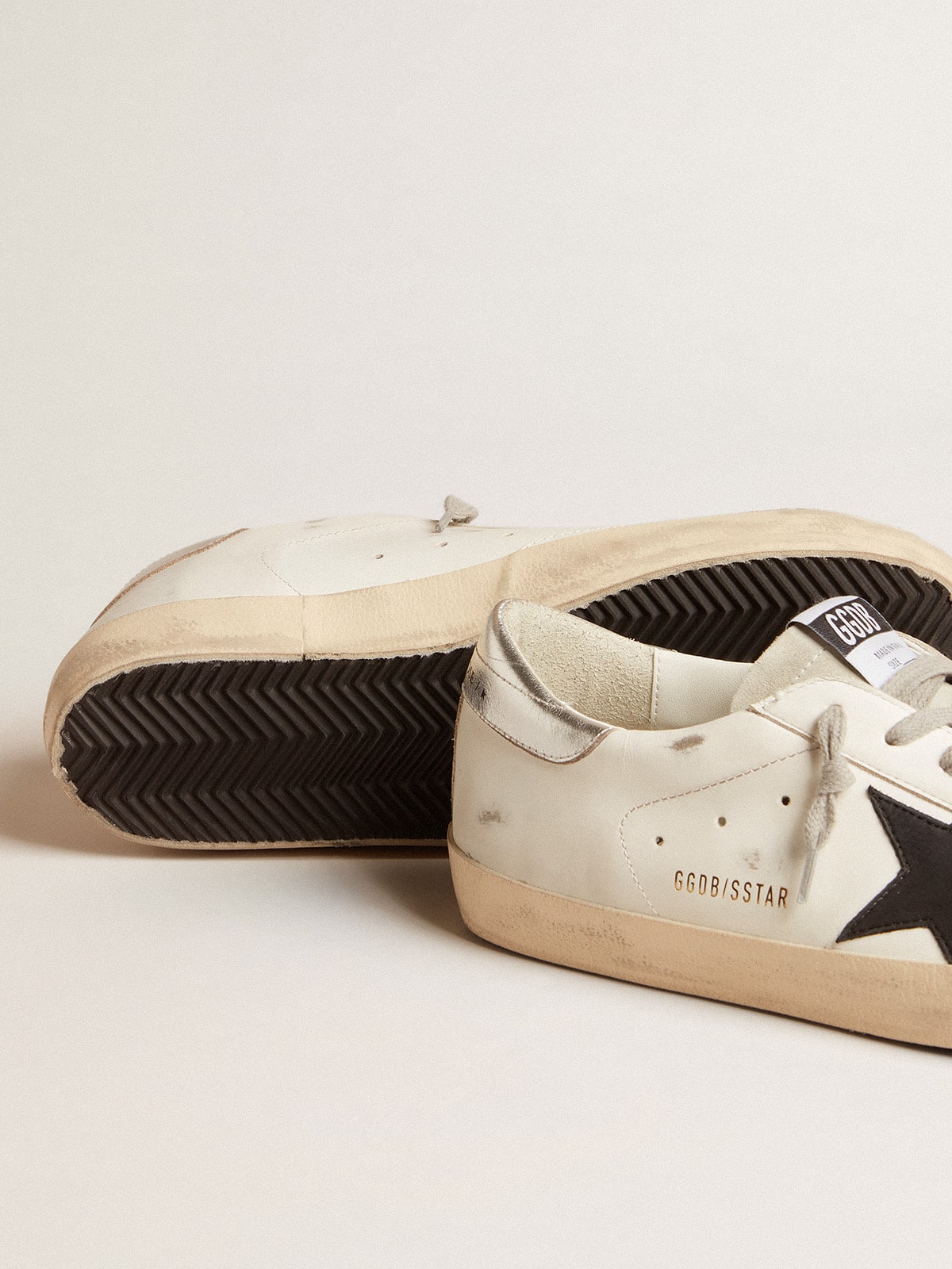Men's Super-Star in white leather with black nubuck star and silver metallic leather heel tab | Golden Goose