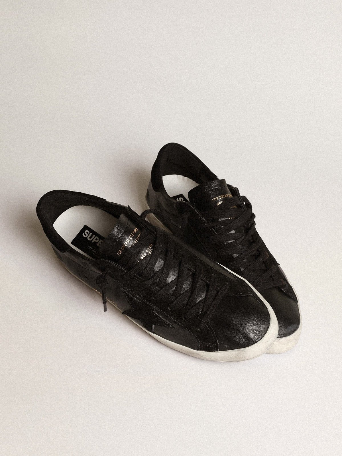 Men's Super-Star in black nappa with black suede star and heel tab | Golden Goose