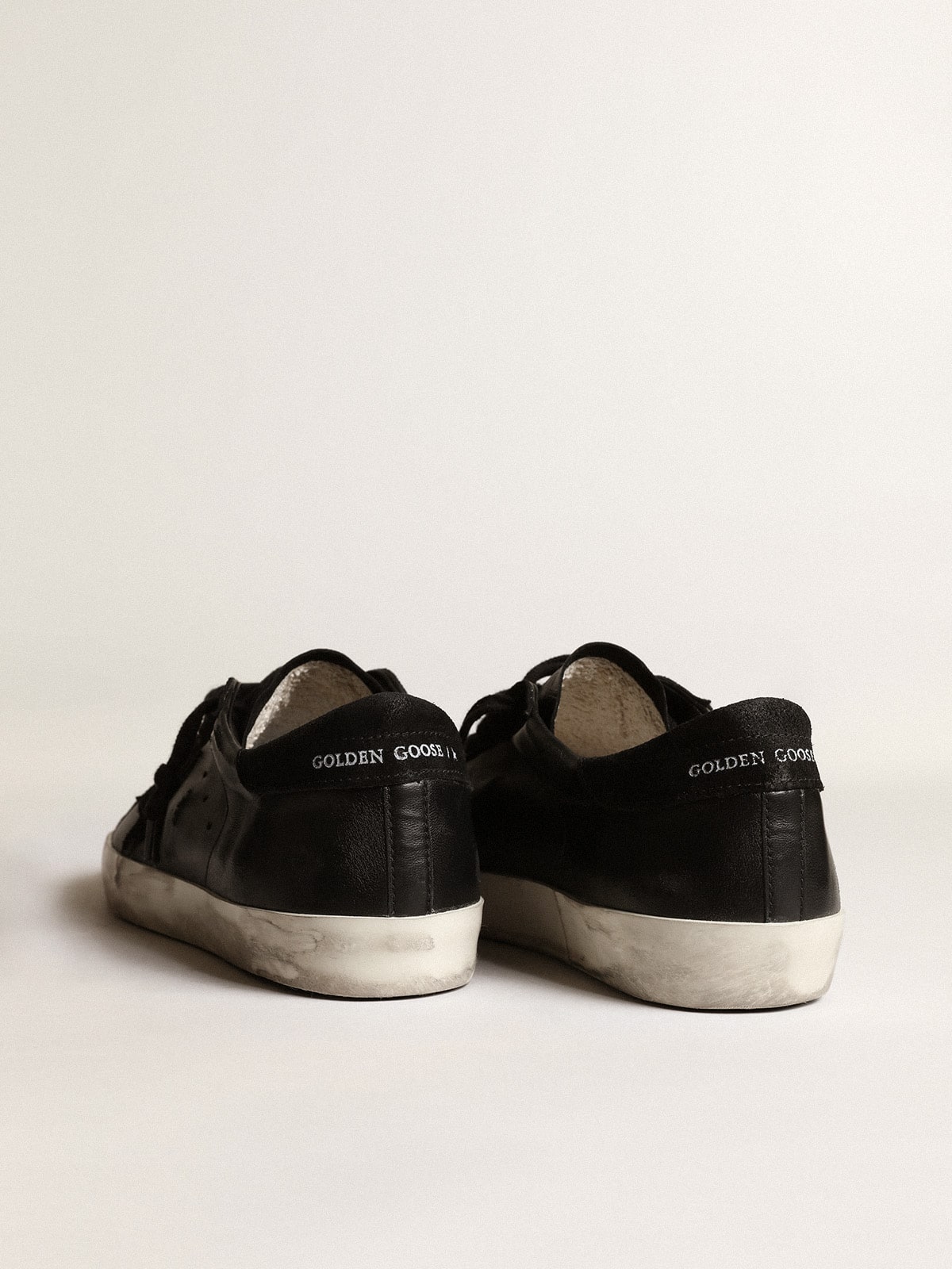 Men's Super-Star in black nappa with black suede star and heel tab | Golden Goose