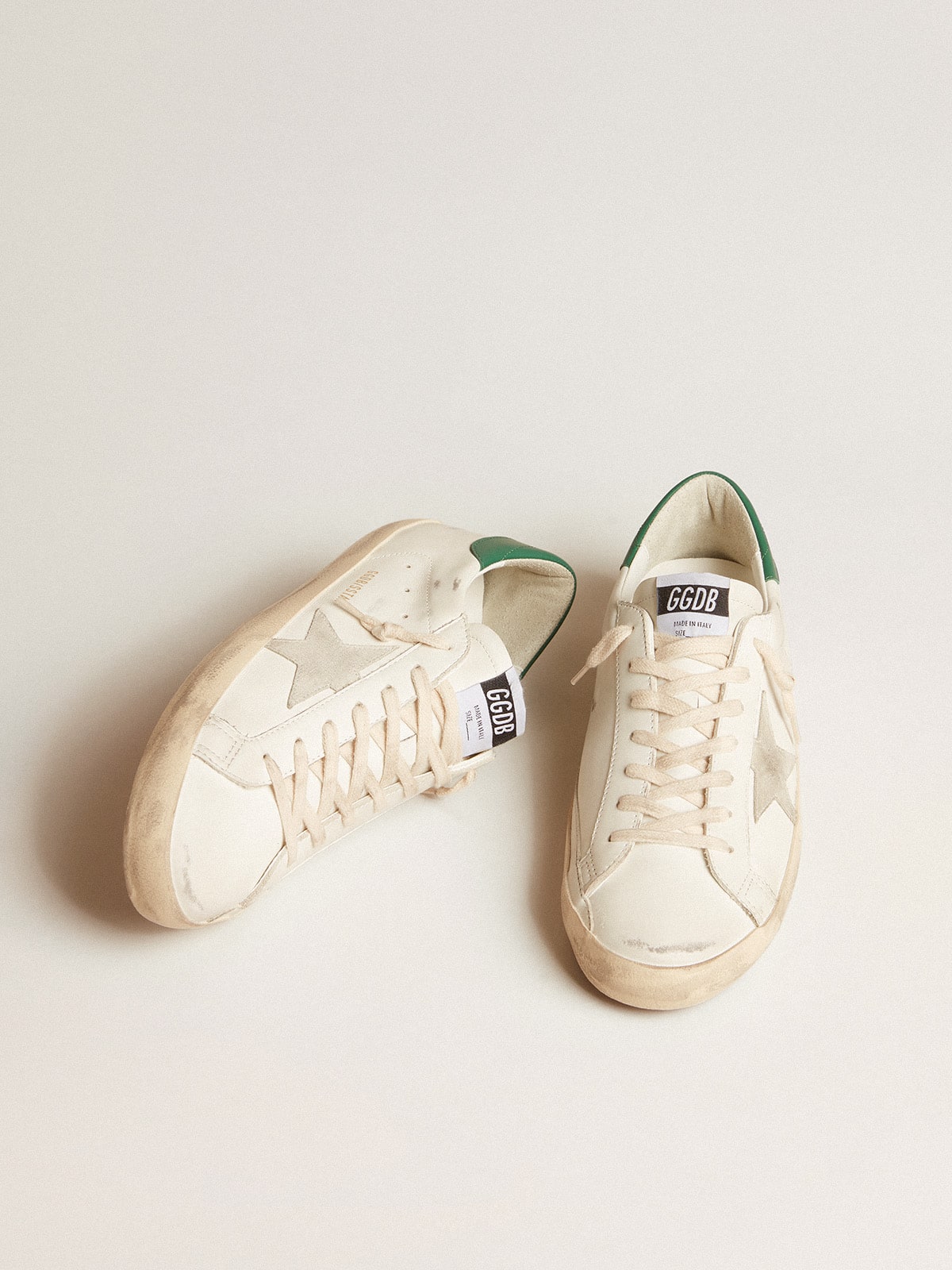 Super-Star in white leather with ice-gray suede star and green leather heel tab | Golden Goose