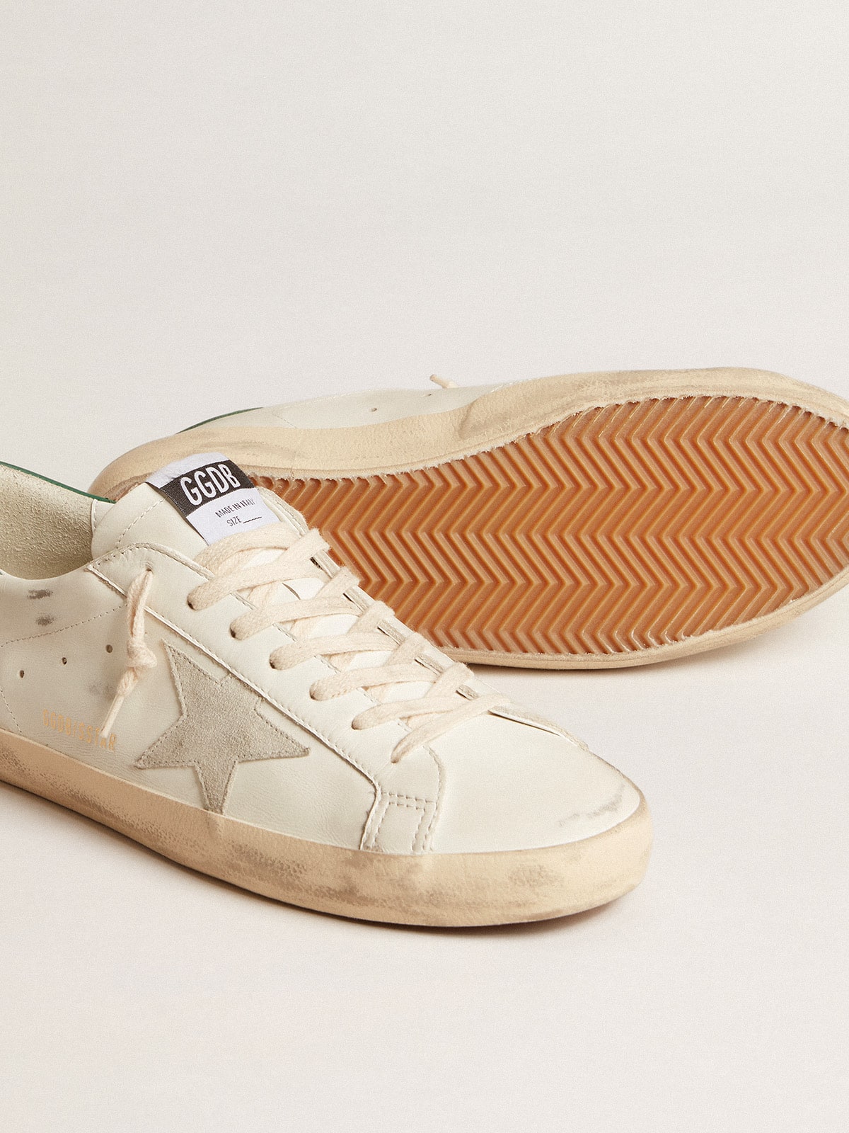 Super-Star in white leather with ice-gray suede star and green leather heel tab | Golden Goose