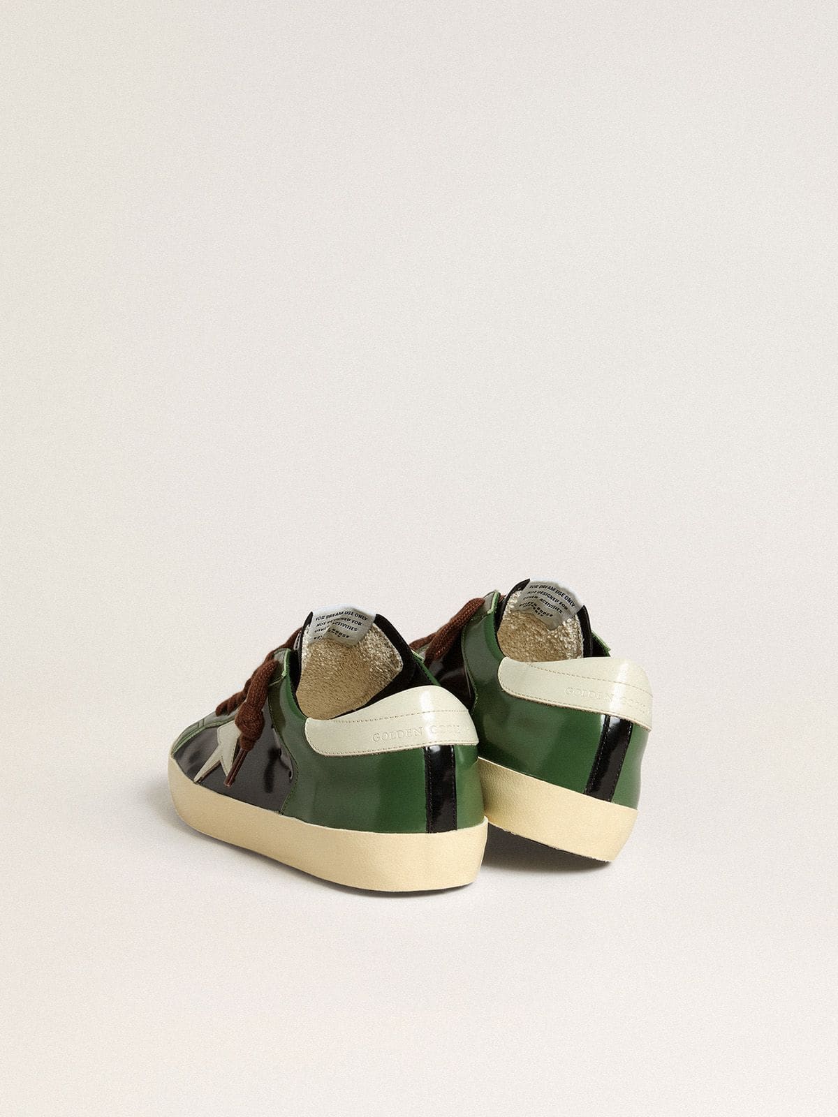 Men’s Super-Star LTD in black laminated leather with white leather star and heel tab | Golden Goose