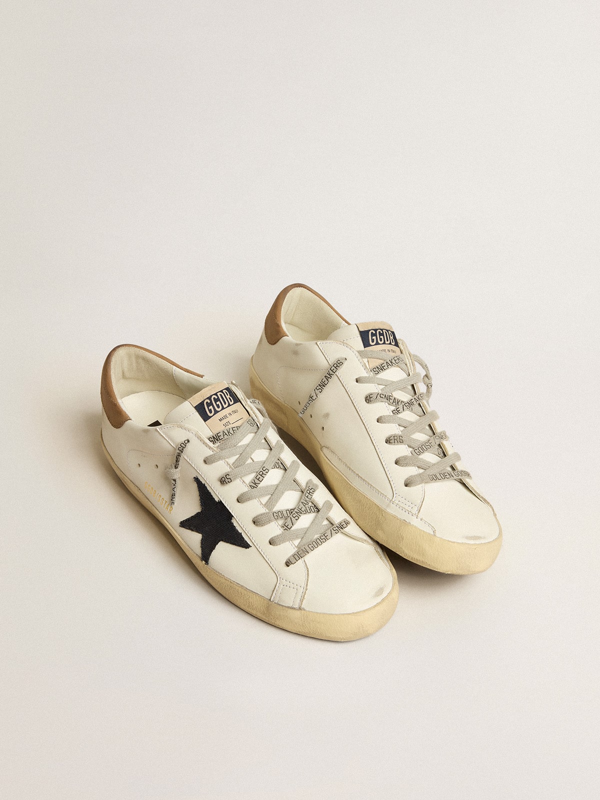 Men's Super-Star in white leather with midnight-blue canvas star and tobacco leather heel tab | Golden Goose