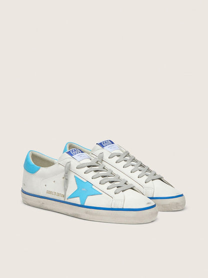 Men's Super-Star LTD in white leather with light blue leather star and heel tab | Golden Goose