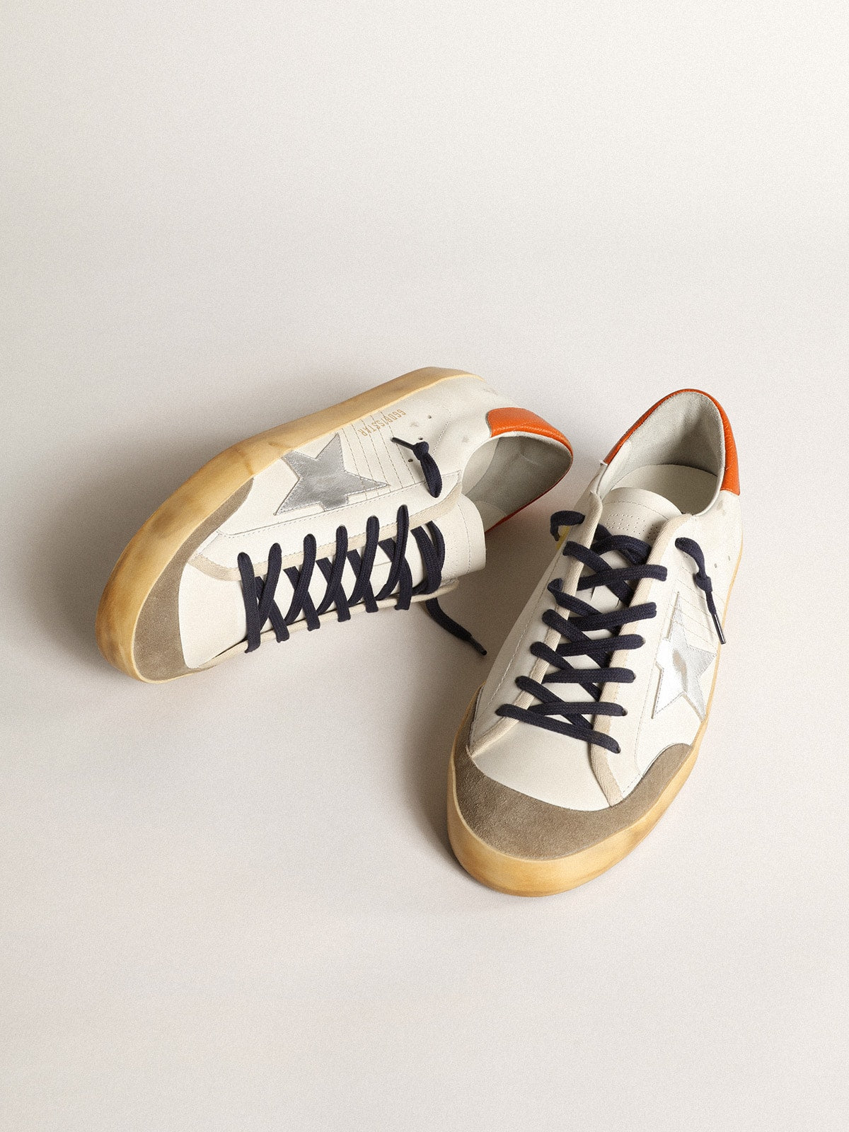 Super-Star Penstar with silver star and orange heel tab | Golden Goose