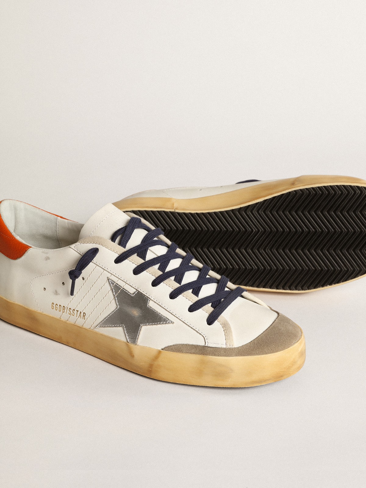 Super-Star Penstar with silver star and orange heel tab | Golden Goose