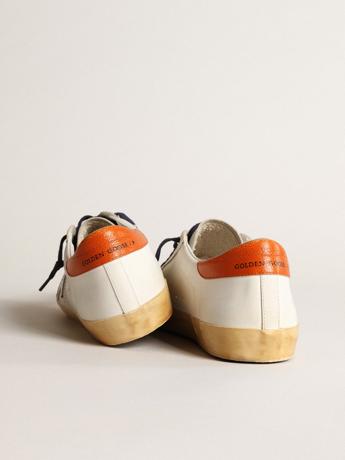 Super-Star Penstar with silver star and orange heel tab | Golden Goose