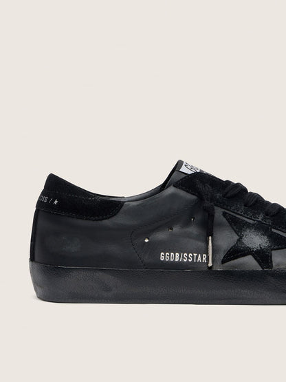 Men's Super-Star in black nappa with black suede star and heel tab | Golden Goose