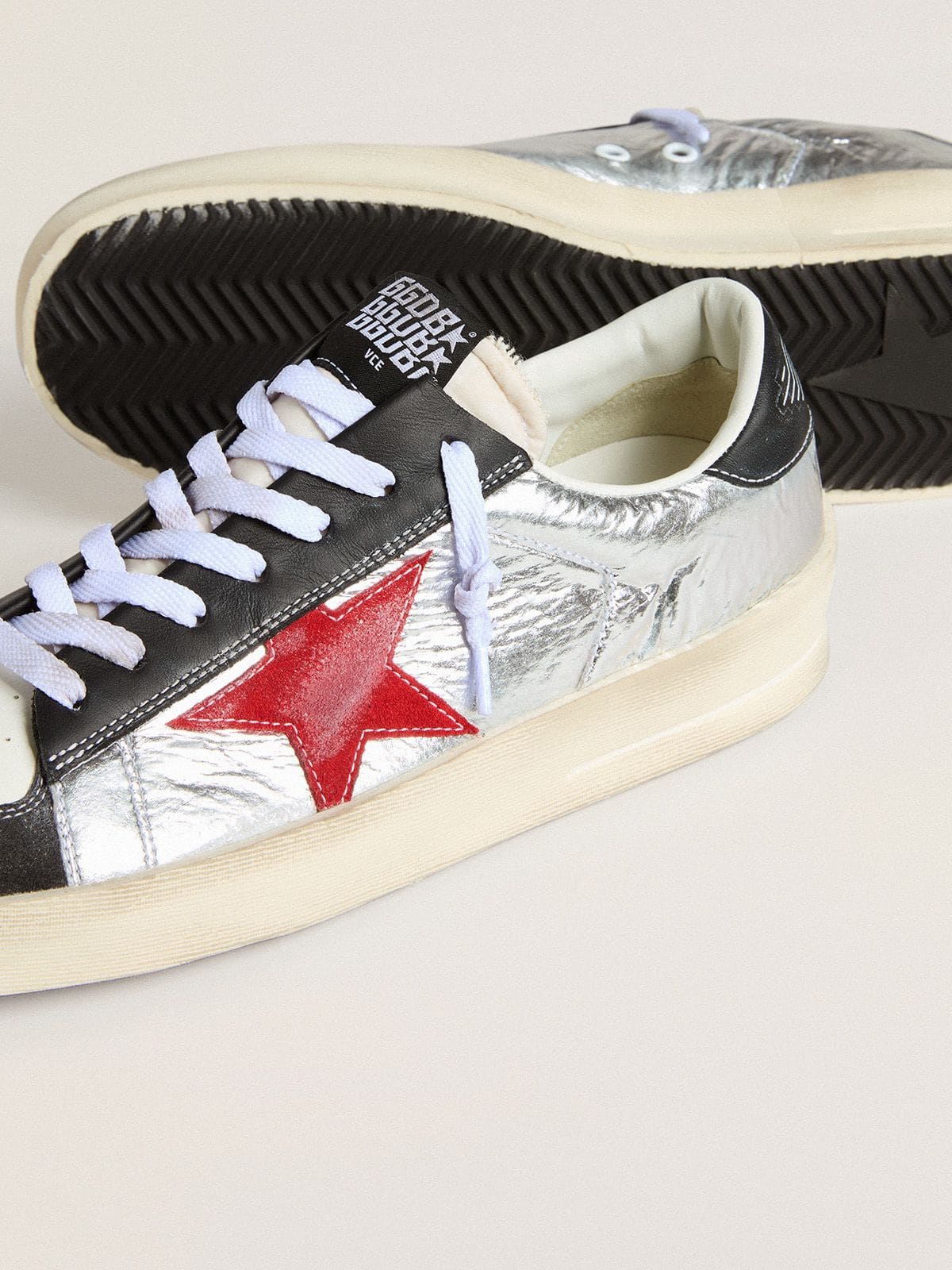 Men’s Stardan in laminated silver nylon with burgundy suede star | Golden Goose