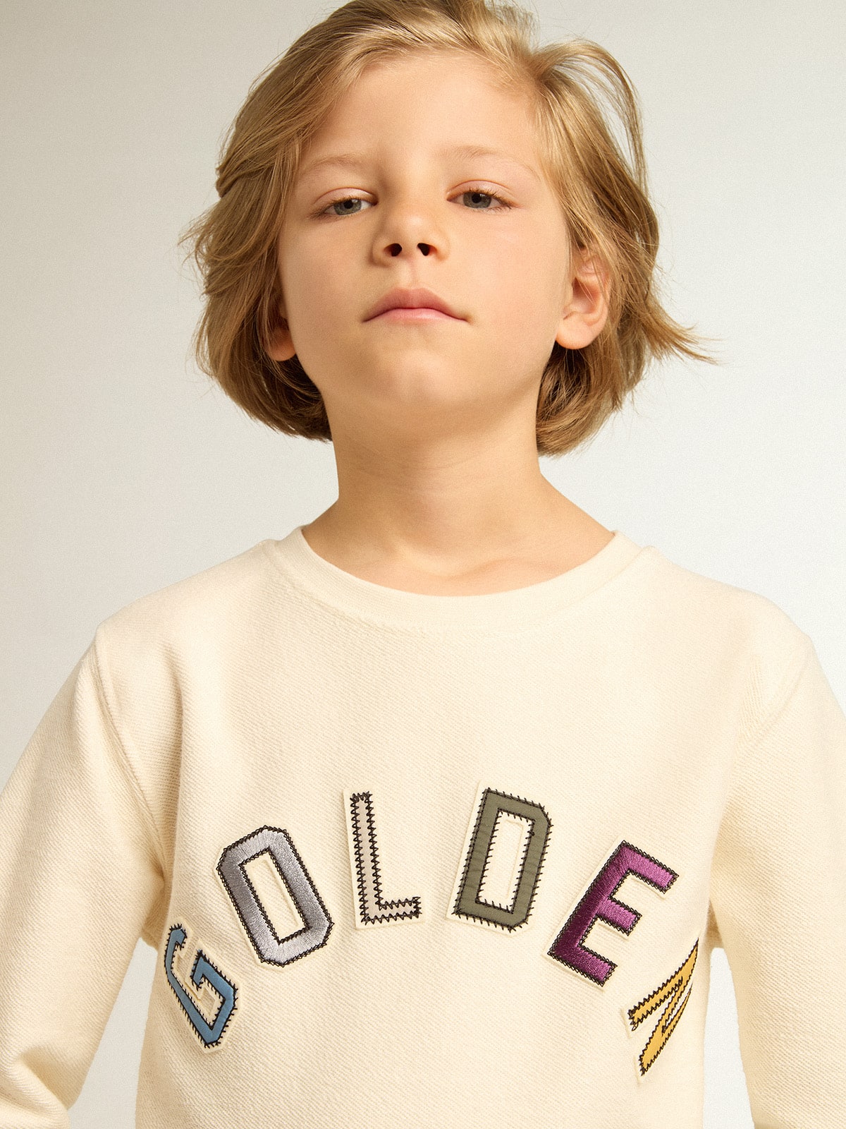 Sweatshirt in aged white with multicolor Golden lettering on the front | Golden Goose